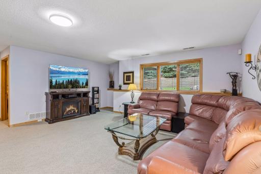 Look-out window with retaining wall and private wooded tree line view.