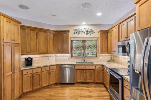 Generous cabinet storage with a floor-to-ceiling pantry.