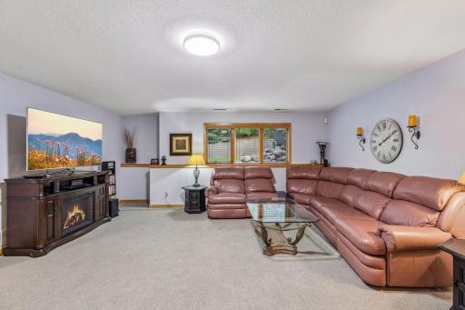 Lower-level family room has 8-foot ceilings and a comfortable carpet.