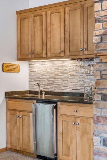 Wet bar and icemaker for the main-level beverage station with granite countertop