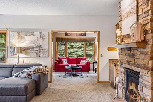 Living room flows into the sunroom for an open, spacious entertaining space.