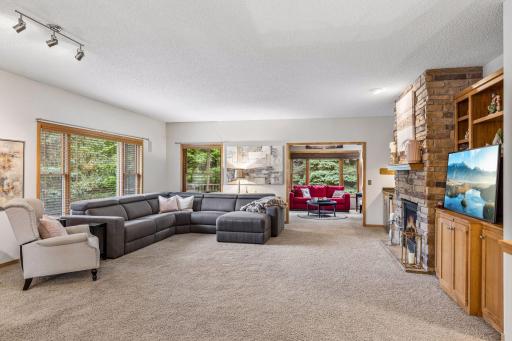 Enjoy lounging in the main-level living room with large windows that include blinds.