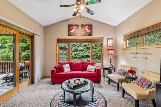 Cozy up in the sunroom with views of pine trees through the west-facing window.