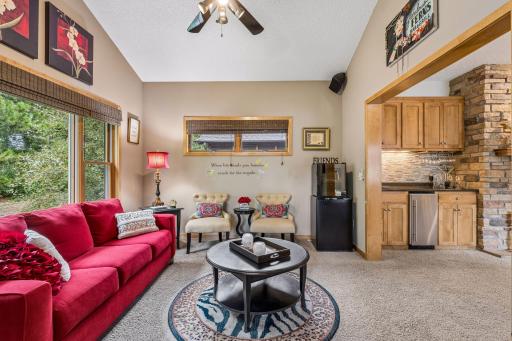 Host an evening happy hour in the sunroom with an adjacent wetbar/beverage area. Cathedral ceiling, ceiling fan/light and sliding glass door to the screened porch