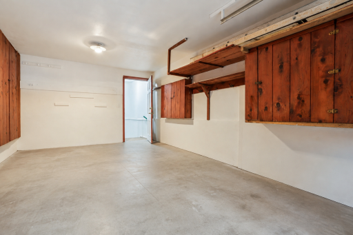 Garage with built in storage. This garage can accommodate an SUV-size vehicle with ease â plenty of room for a vehicle plus tools, bikes, and seasonal gear. The driveway fits 2 vehicles, providing convenient additional parking for family or guests.