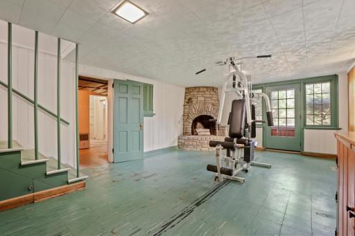 Basement Recreation Room - This room offers endless possibilities â a recreation room, playroom, or home office. Freshly painted and full of potential, it features generous storage cupboard space and a beautiful fireplace.