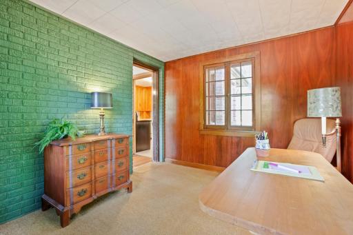 Main Floor Den - The sellers used it as their TV room, but it would make an equally wonderful home office, reading retreat or non-conforming main floor bedroom.
