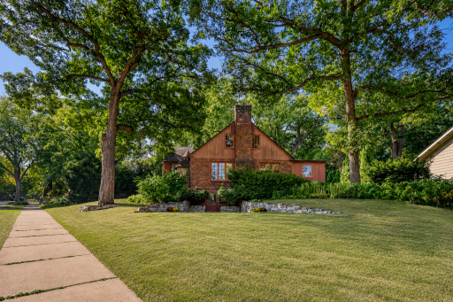 This is a large corner lot with established gardens and beautiful trees.