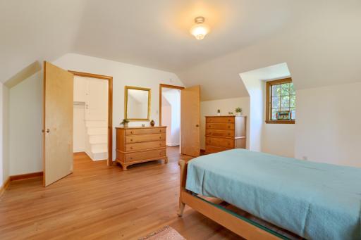 Bedroom #3 - This spacious room includes a large walk-in closet, a cedar walk-in closet, plus stairs to an attic for storage. There are plenty of potential uses of this large closet including adding a bathroom to make a primary en suite.