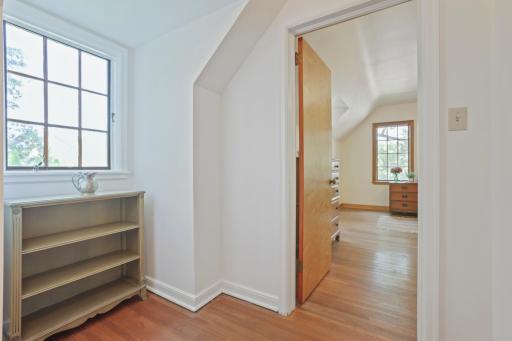 This hallway is between bedroom #2 to bedroom #3 and has a space for a bookshelf.