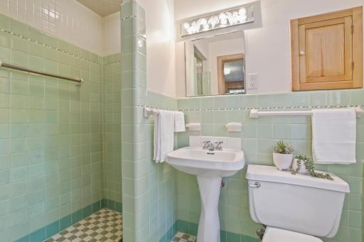 Bathroom #2 - This 3/4 bath has the original light green tile that is in perfect condition.