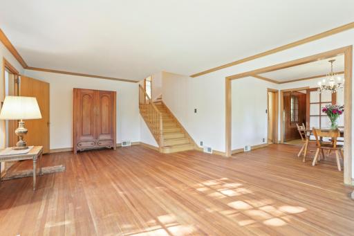 Living room - Glorious sunshine and privacy since the house is situated up on a small hill. Beautiful natural wood is used throughout the home including oak, white oak and birch.