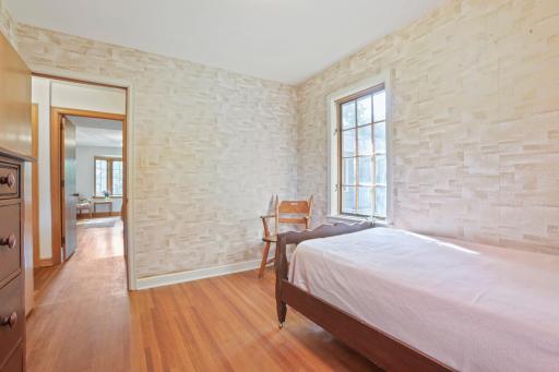 Bedroom #2: This room has a large closet that is behind the photographer of this picture. Through the doorway on the left, you can see into bedroom #1 and the bathroom is located between these 2 rooms on the right.