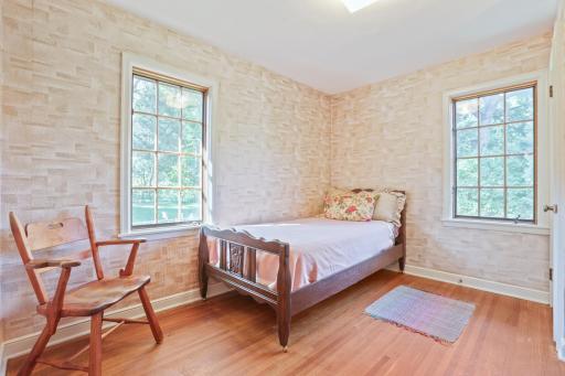Bedroom #2 - This bedroom has lovely vintage wallpaper. The windows are overlooking the back and side of house.