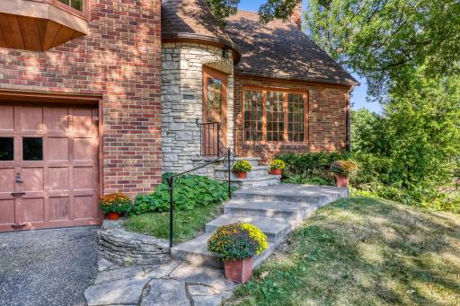 Built in 1941, this home has held onto its character for over 80 years. Set up on a corner lot and small hill, this well-constructed home has a regal appearance with the striking turret-style front door entry.