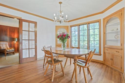 Dining room - There are 2 built-in shelves in the corners of the dining room for display and storage.