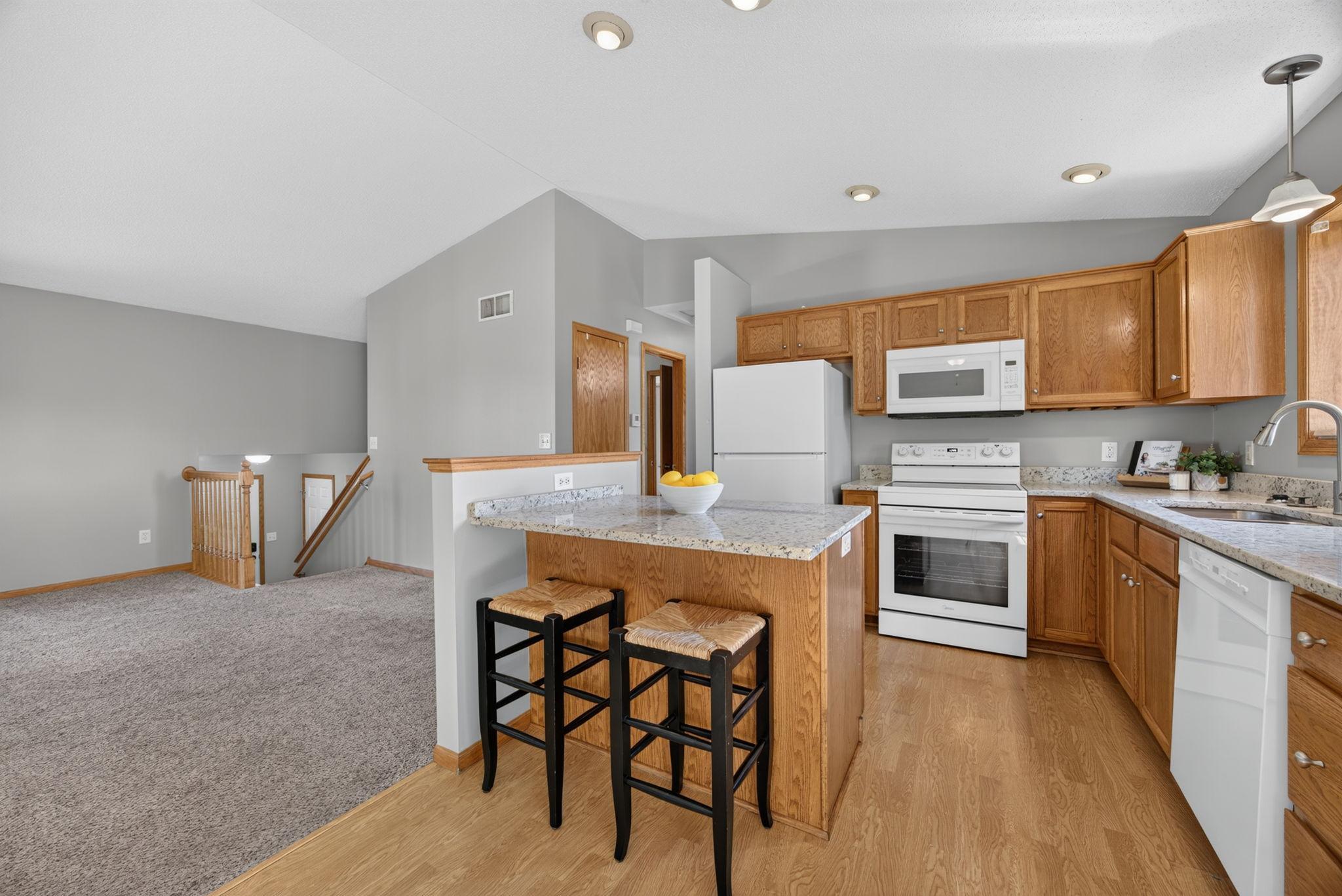 The open layout flows seamlessly into the living room, making everyday living and entertaining a breeze.