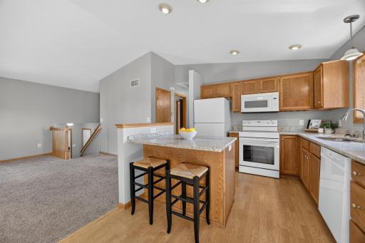 The open layout flows seamlessly into the living room, making everyday living and entertaining a breeze.