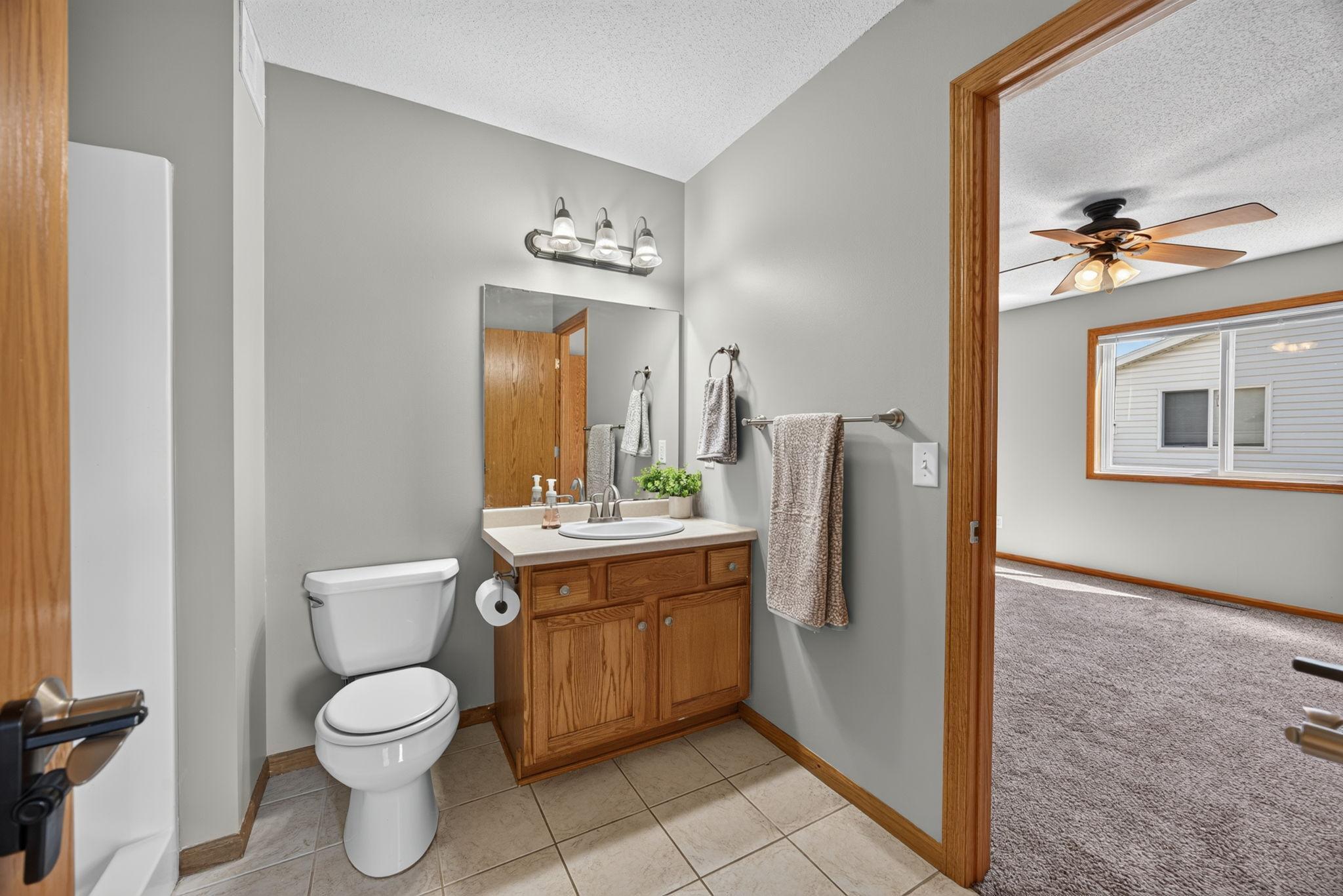 Main-floor bathroom with convenient direct access from the primary bedroom.