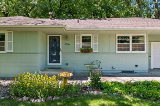 A freshly painted exterior and a brand-new garage door welcome you inside the home.