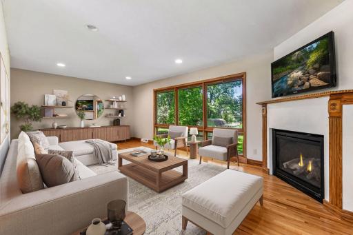 Real hardwood floors lead into the main level family room - *VIRTUALLY STAGED*