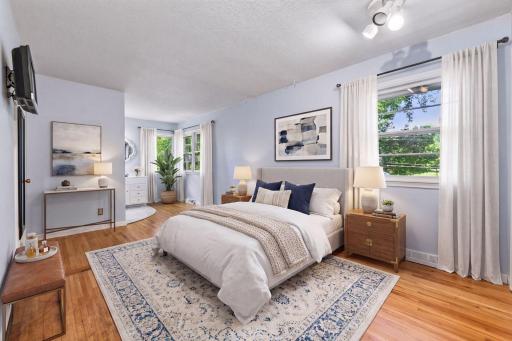 The primary bedroom features a private 3/4 bath with a tiled shower - *VIRTUALLY STAGED*