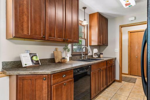 This opens to a sunny kitchen with abundant cabinet storage - *VIRTUALLY STAGED*