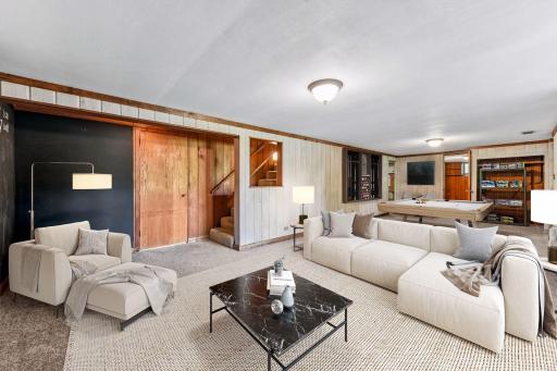 Retreat downstairs to an expansive family room with walkout access to the screened-in porch - *VIRTUALLY STAGED*