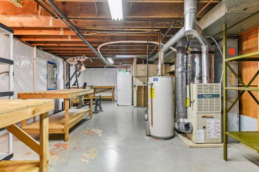 The utility room offers ample storage, workshop space and laundry service.