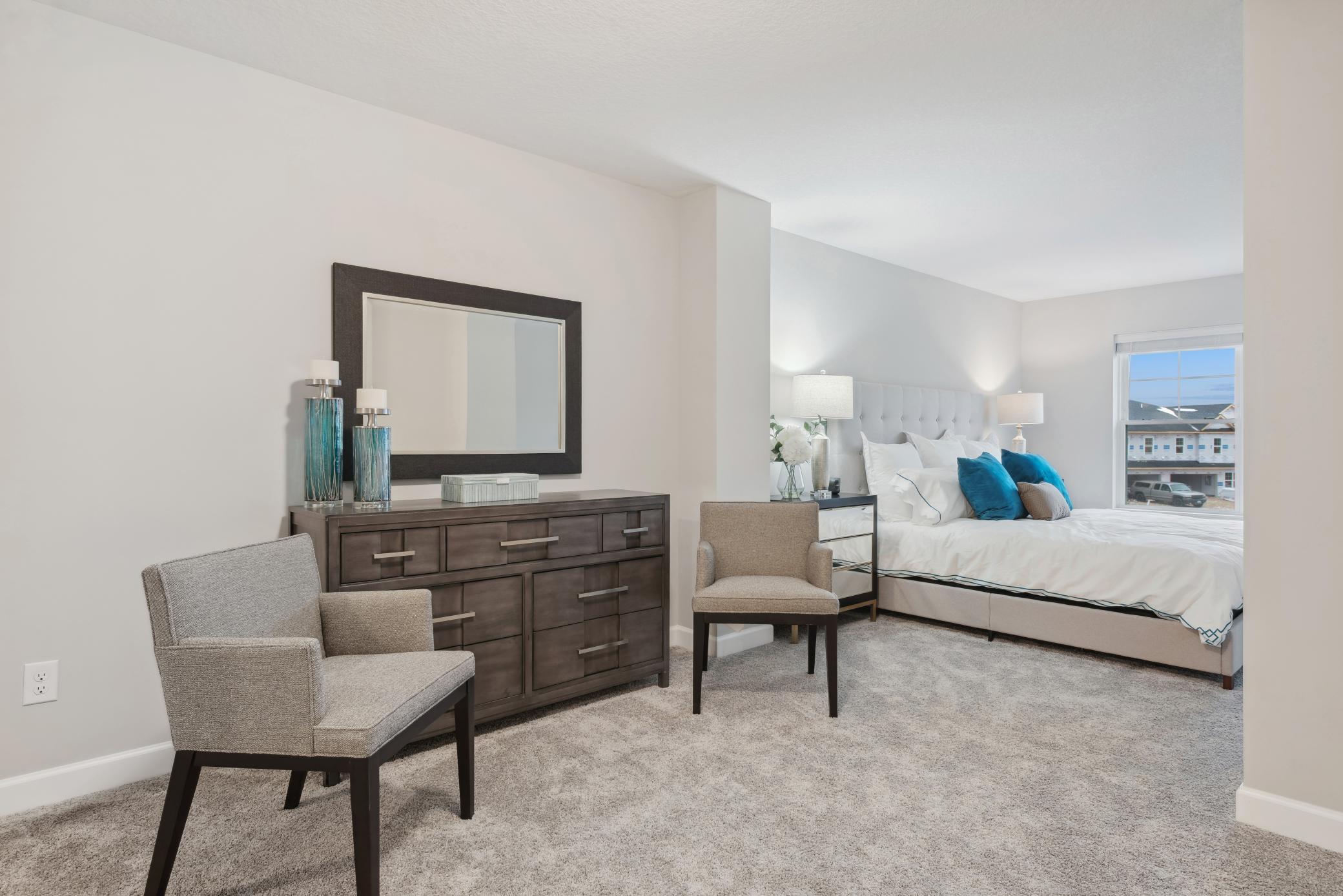 (Photo of a decorated model, actual homes finishes will vary) Another view of the primary bedroom.