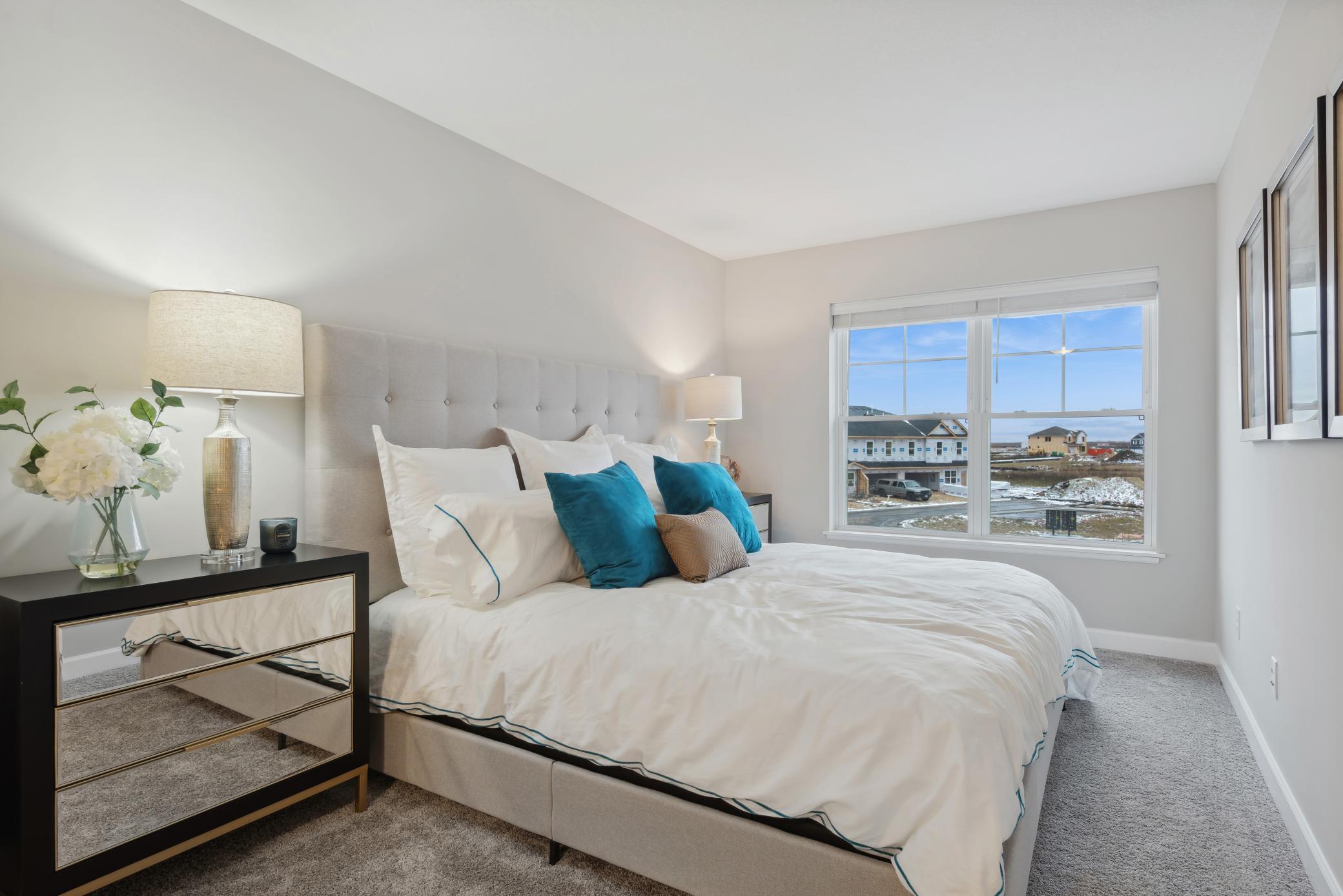 (Photo of a decorated model, actual homes finishes will vary) Upper level laundry has never made chores easier!