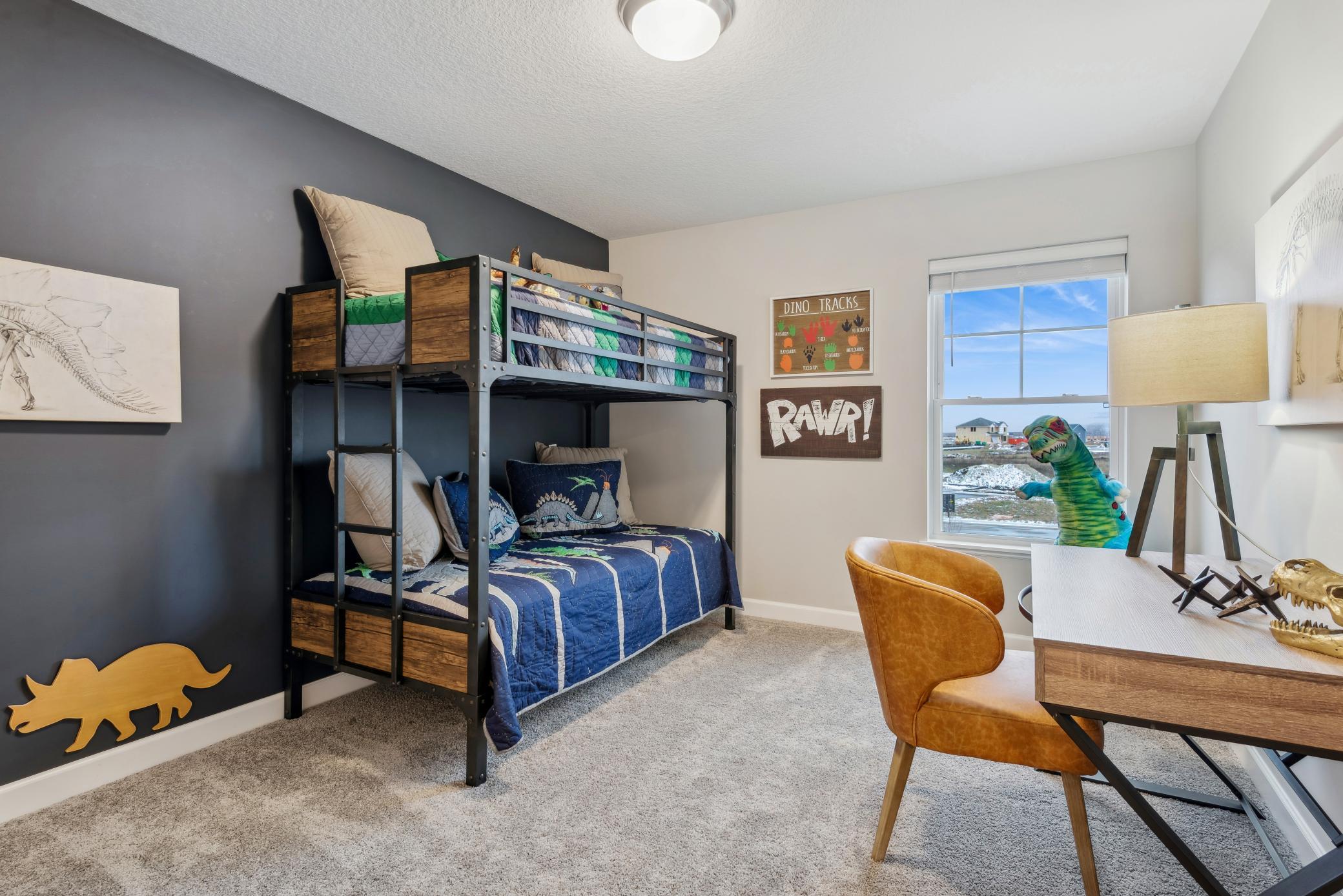 (Photo of a decorated model, actual homes finishes will vary) The second secondary bedroom.