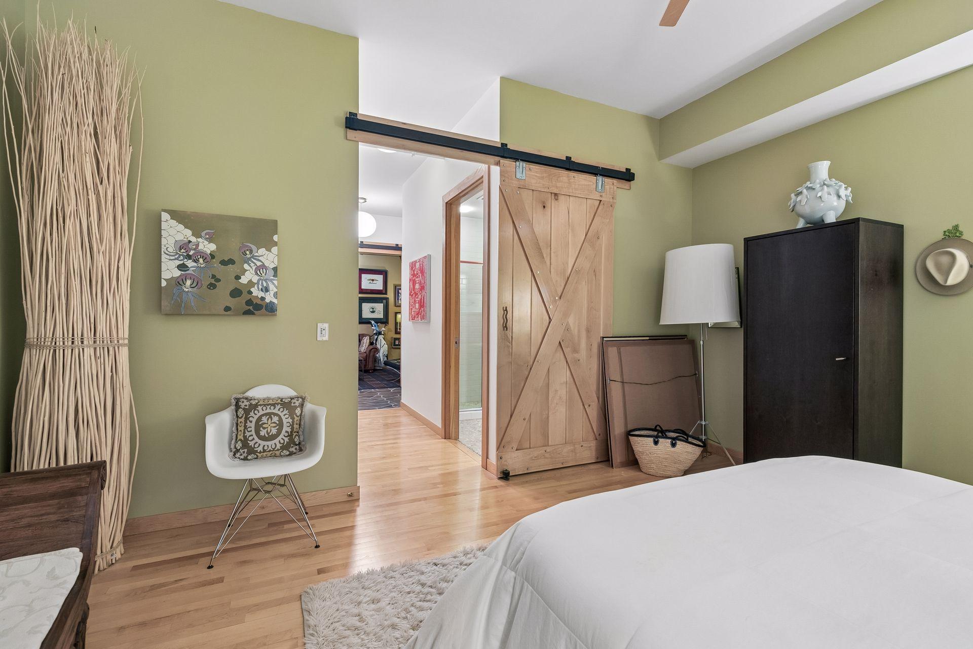 Second bedroom with barn door to the hall
