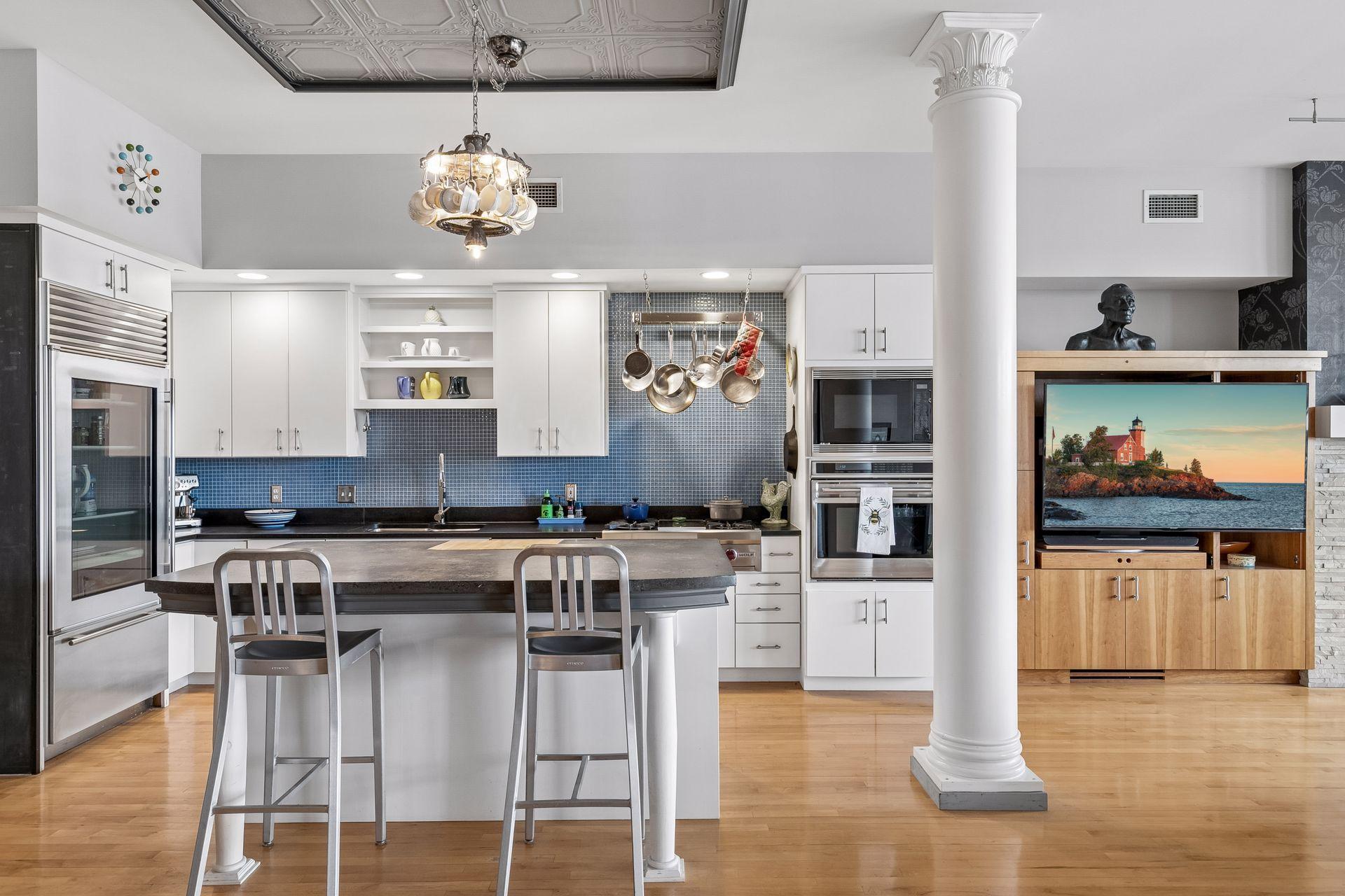 Island seating for four, wall ovens and warming drawer