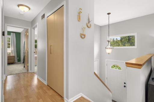 Step inside and enjoy the natural light from the transom window over the front door