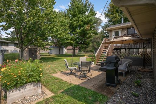 A view of the patio and fenced back yard
