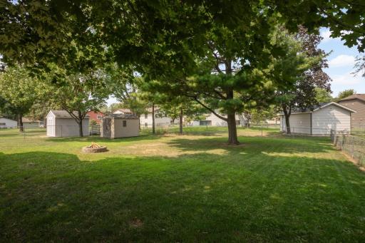 Fenced back yard with lots of space for kids or pets to run and play