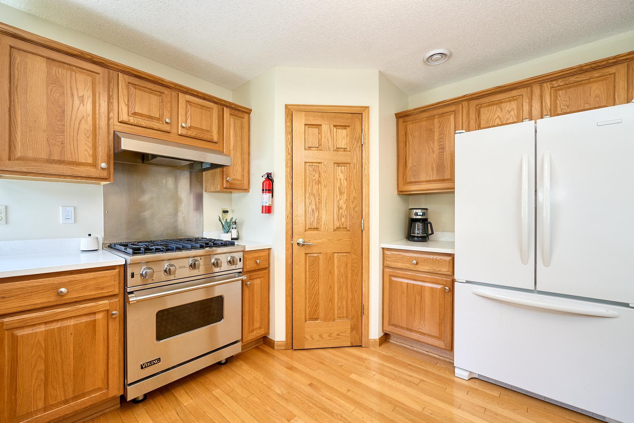 Chefs kitchen includes Viking range and hood, coffee bar, and step-in pantry