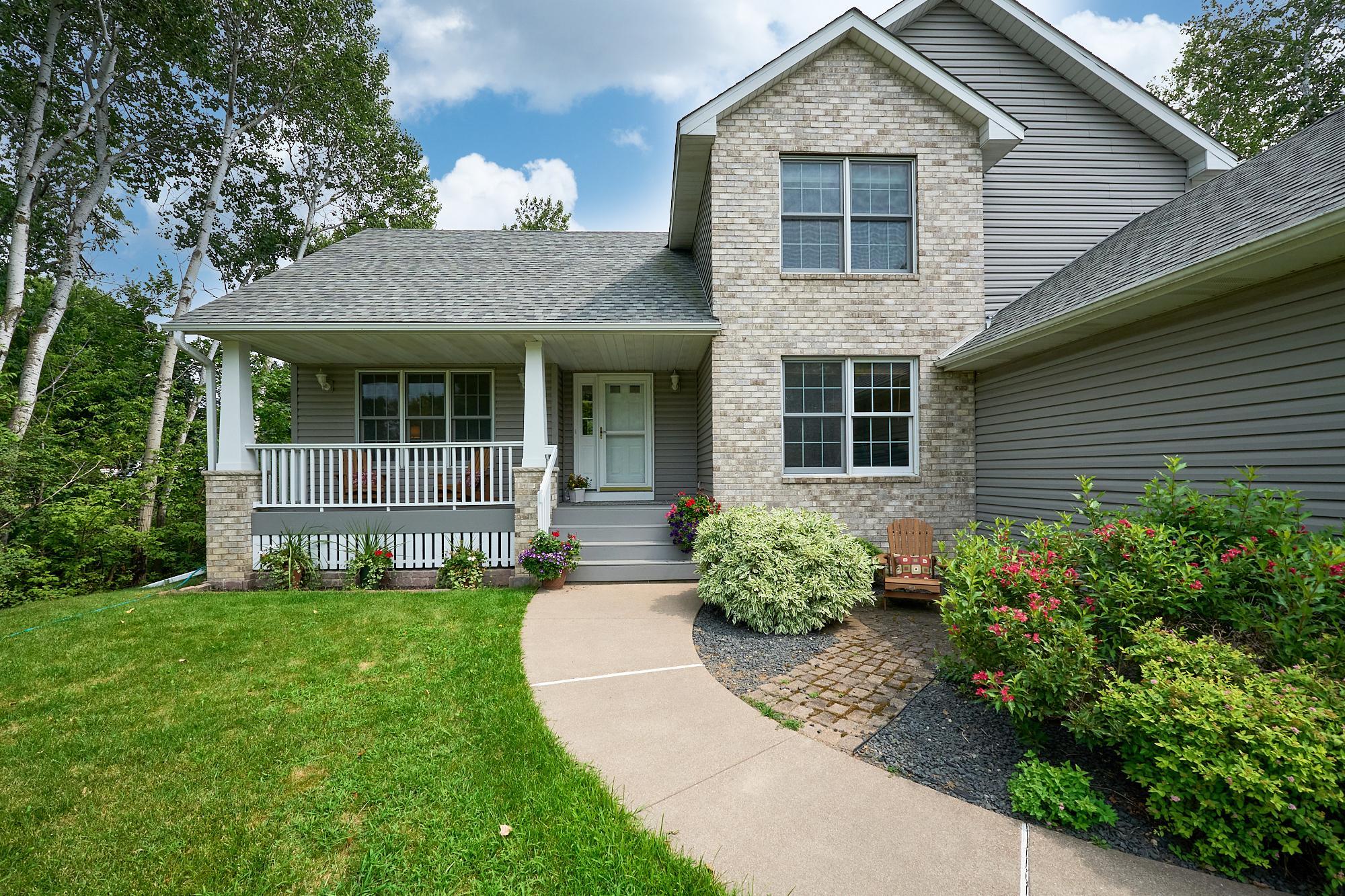 Beautiful Perennial Garden, large front porch, brick front, roof new 2022.