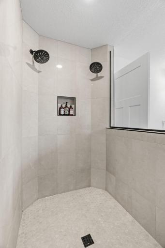 Stunning Serenity Shower w/ floor-to-ceiling tile + dual shower heads