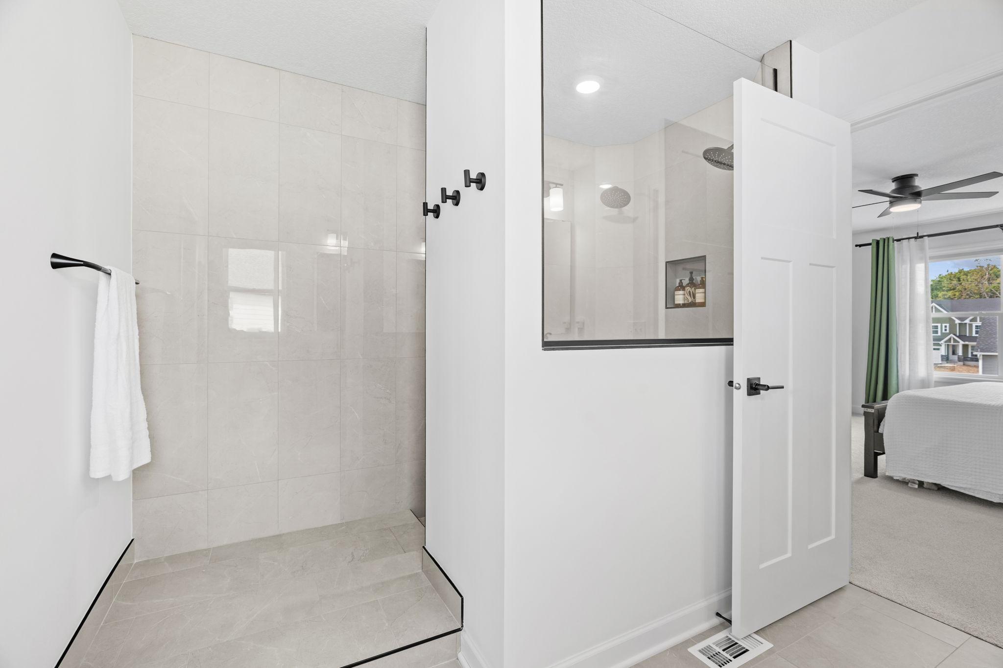 Stunning Serenity Shower w/ floor-to-ceiling tile + dual shower heads