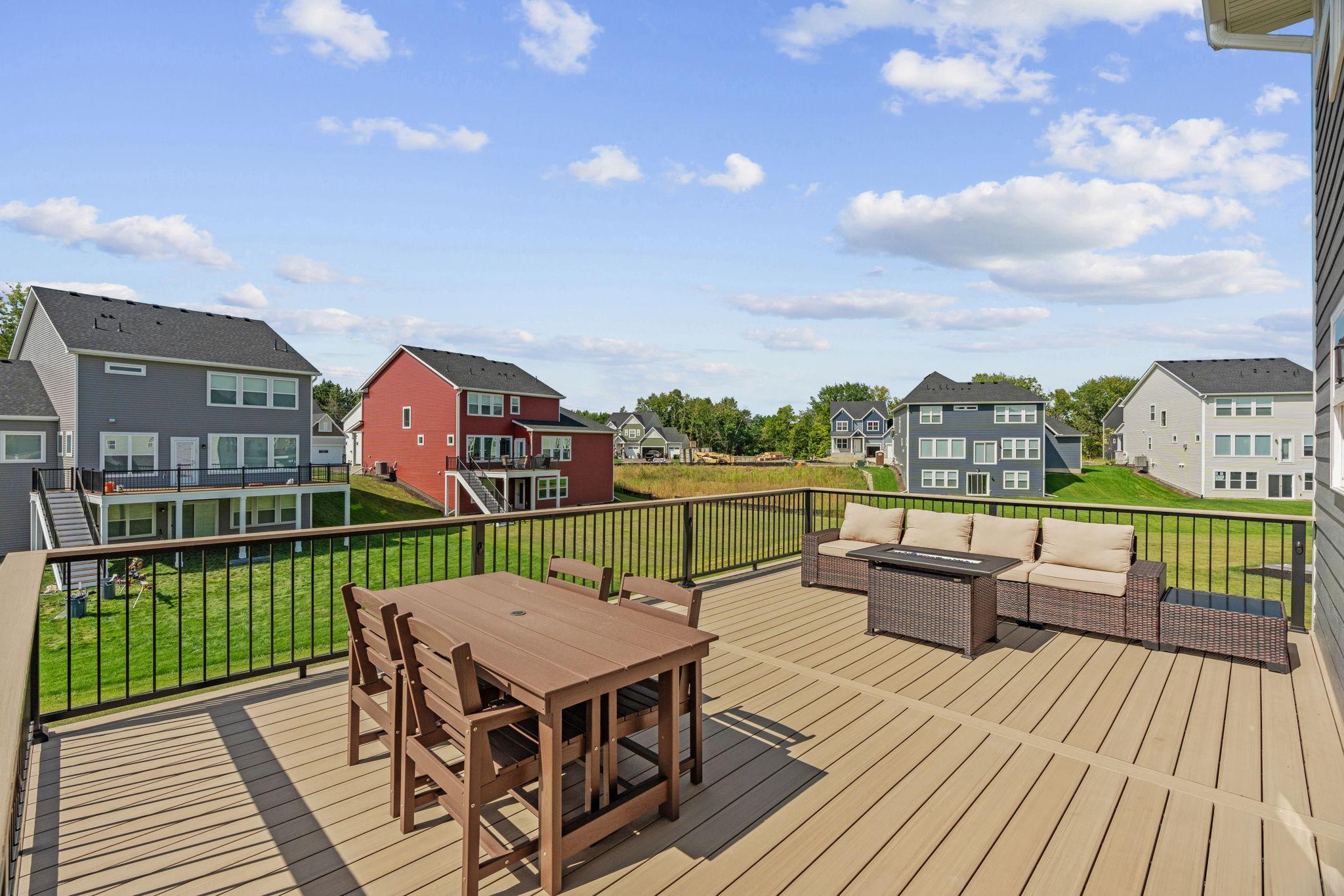 Walk out to newly added 17x20 TimberTech maintenance-free deck w/ lighting + drink rail.