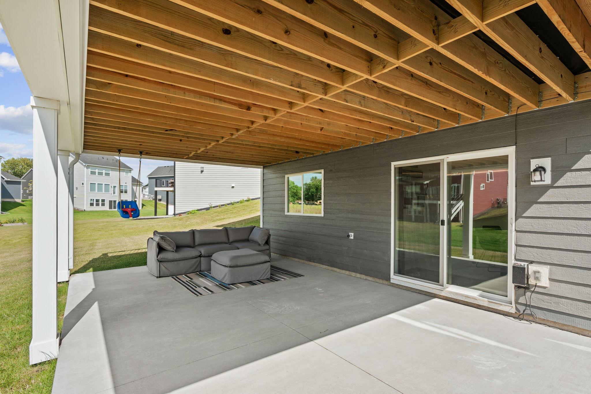 Walk out from lower level to additional concrete seating space