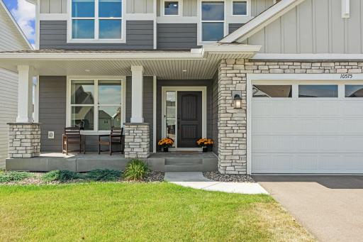 Amazing curb appeal w/ welcoming front porch, stunning stone exterior + Ring doorbell. L