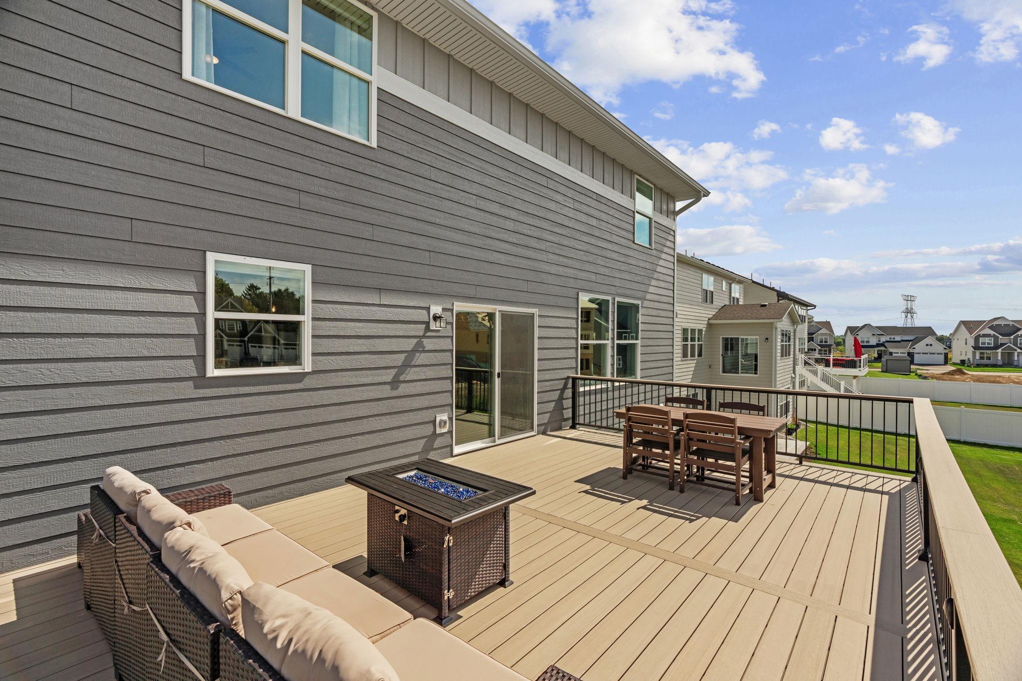 Walk out to newly added 17x20 TimberTech maintenance-free deck w/ lighting + drink rail.