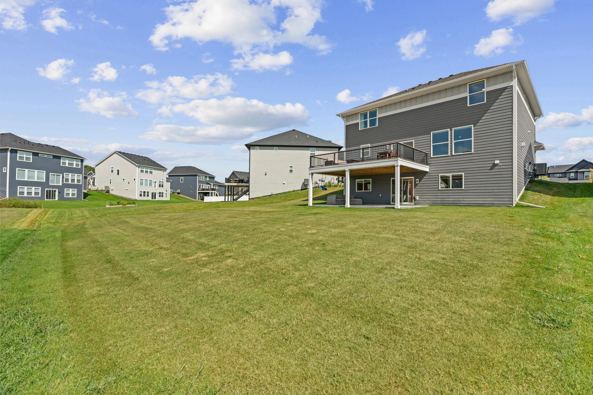 Spacious backyard w/ newly added 17x20 TimberTech maintenance-free deck w/ lighting + drink rail.