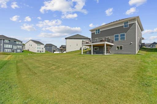 Spacious backyard w/ newly added 17x20 TimberTech maintenance-free deck w/ lighting + drink rail.