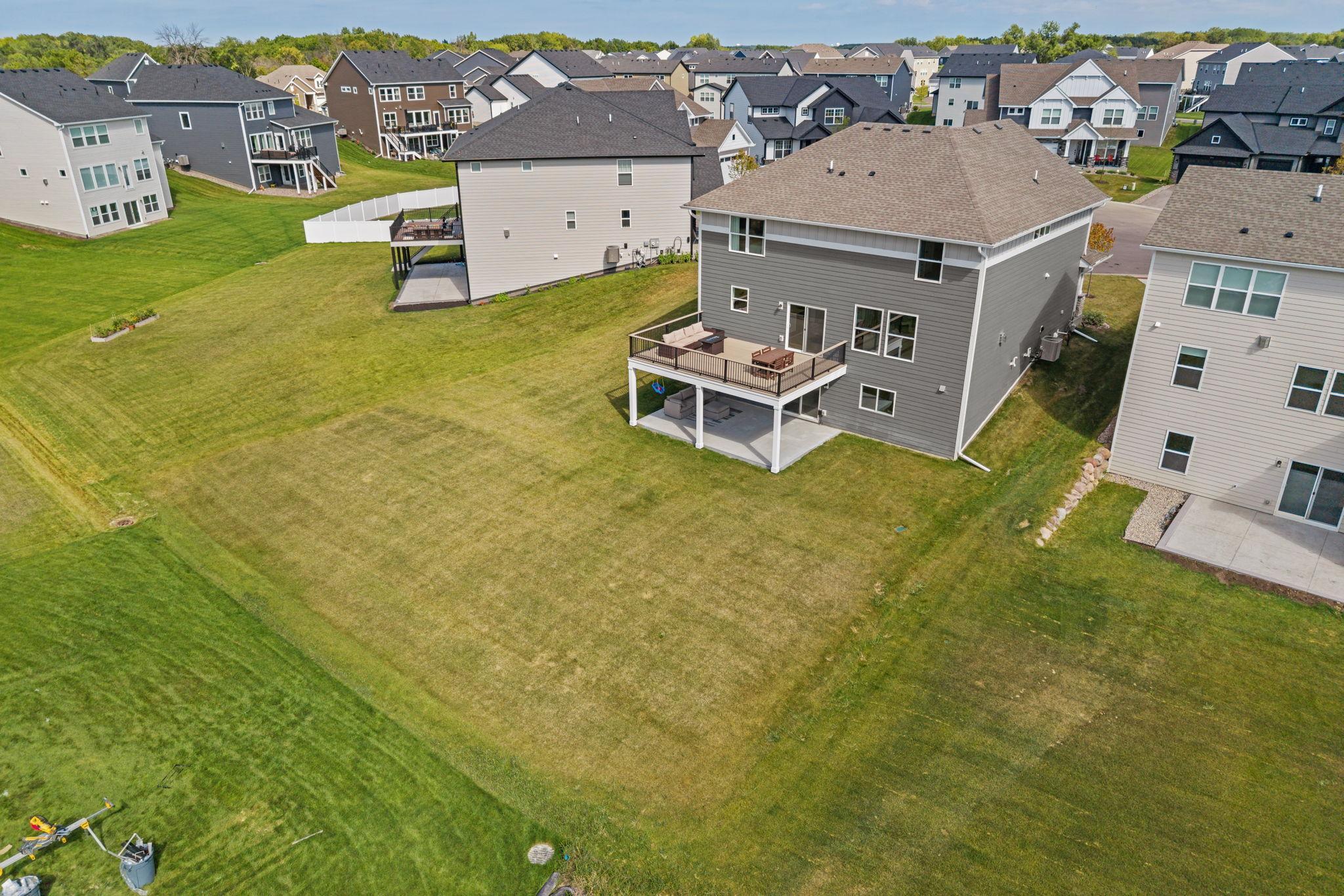 Spacious backyard w/ newly added 17x20 TimberTech maintenance-free deck w/ lighting + drink rail.