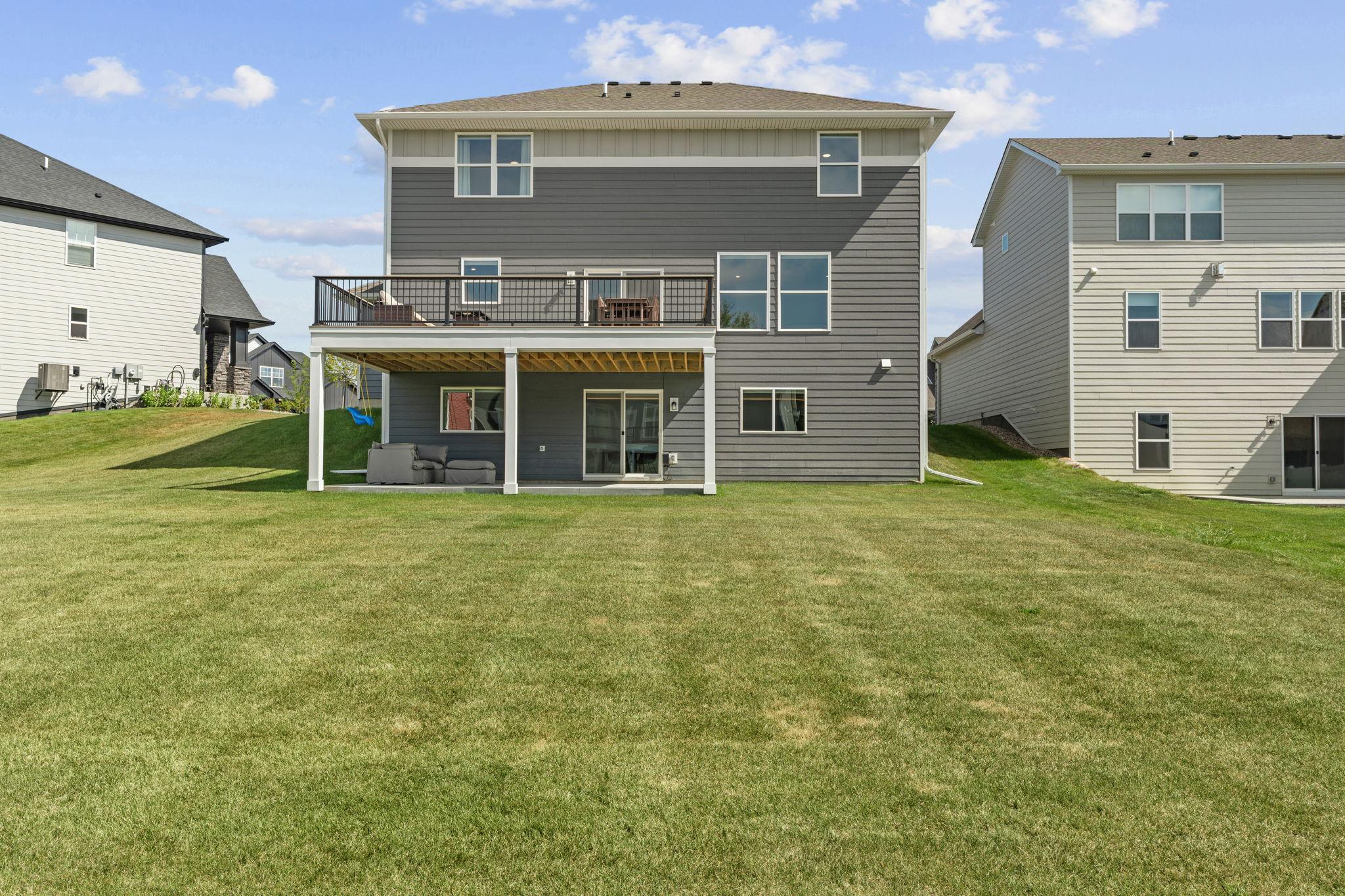 Spacious backyard w/ newly added 17x20 TimberTech maintenance-free deck w/ lighting + drink rail.