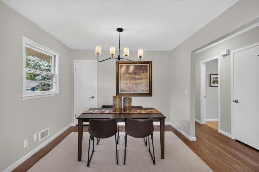 Dining space with refinished hardwood floors.